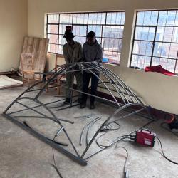 V2SDF training advances as educators use assembly jigs to construct the precise skeleton of the new Prince 23 model.