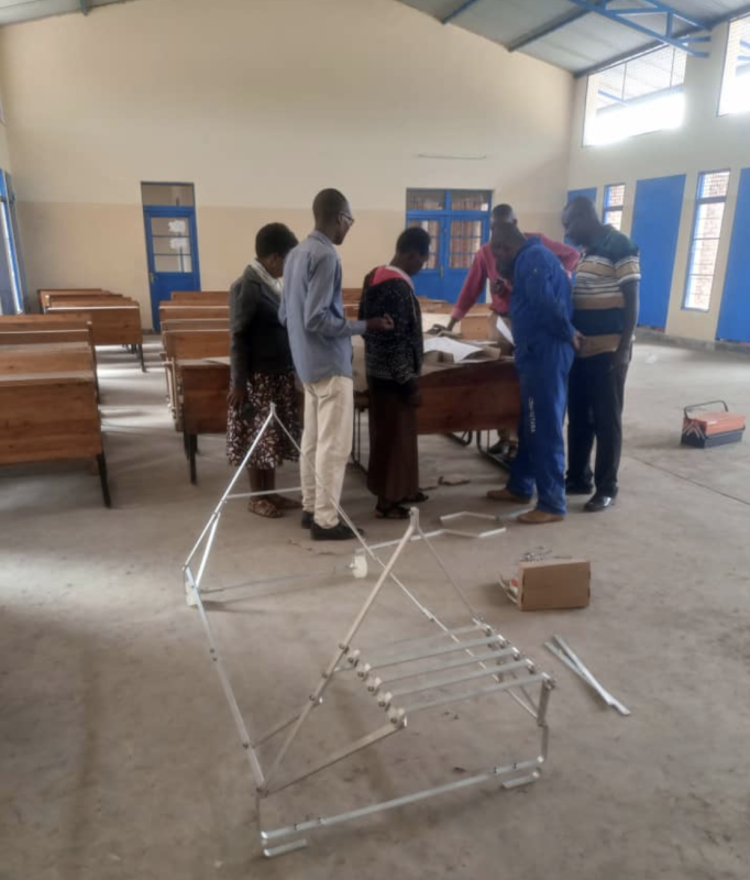 CEM Gitaba Teachers Assemble the SK 14 Solar Cooker