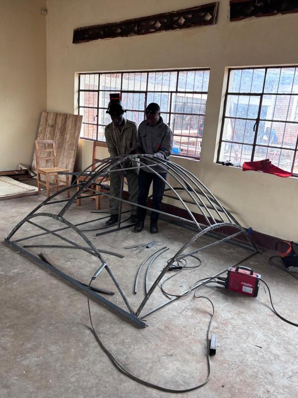 V2SDF training advances as educators use assembly jigs to construct the precise skeleton of the new Prince 23 model.